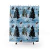 Shower curtain with black evergreen trees, pinecones, acorns, and pine branches on a soft blue background, evoking a serene, wintry forest scene.