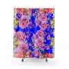 Vibrant shower curtain featuring a bold blue background adorned with bright pink peonies and colorful flowers, creating a lively, cheerful tone.