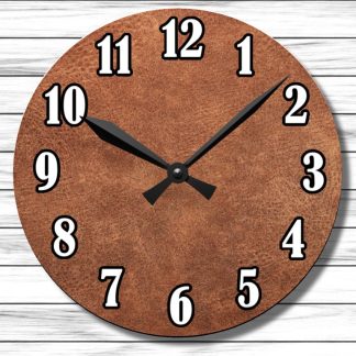 A round wall clock with a textured brown face and bold black and white numbers on a light wood background. The clock shows 10:10.