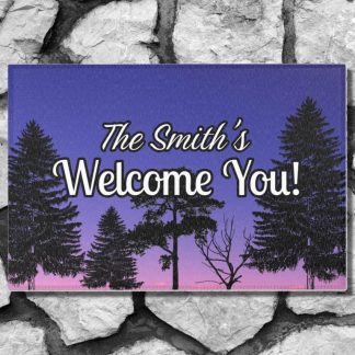Welcome mat on a stone step with "The Smith's Welcome You!" text over a gradient sky from purple to pink, with silhouettes of tall pine trees, creating an inviting mood.