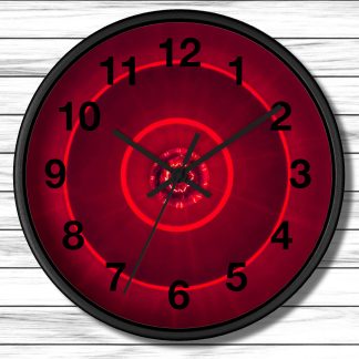 A wall clock with black numbers and hands on a circular red background, featuring concentric glowing circles, on a white wooden panel wall.