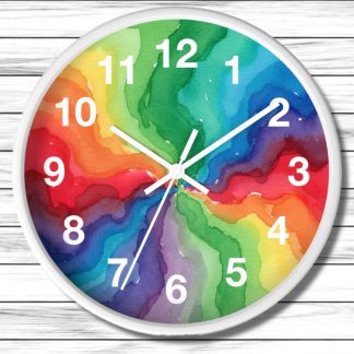 Round wall clock with a white frame, featuring vibrant watercolor swirls in rainbow colors. White numerals and clock hands stand out against the colorful background, creating a dynamic and cheerful visual. The clock is set against a white wooden surface.