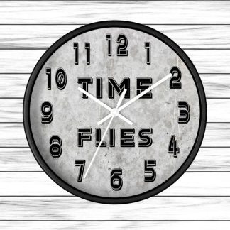 Round wall clock against a white wooden background. The clock face reads "TIME FLIES" between 10 and 2 o'clock, with bold black numbers.