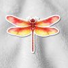 Sticker of a vibrant red and orange dragonfly with detailed wings on a soft, textured gray surface. The image conveys a sense of warmth and lightness.