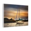 A serene sailboat on calm water at sunset, with a vivid sky blending orange and blue hues.