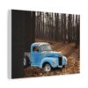 A rustic blue vintage truck with visible rust sits partially hidden among trees in a serene, sunlit forest. The earthy tones convey a nostalgic mood printed on canvas wall art.