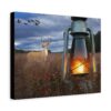 Canvas wall art features a serene landscape with a deer standing in a field under a cloudy sky. A lit lantern glows warmly in the foreground, and a flock of birds is flying above.
