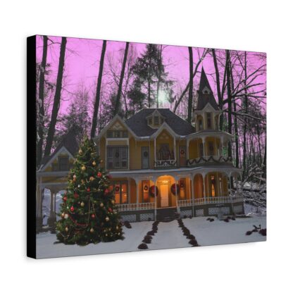 Canvas wall art print with Victorian house in snowy forest, adorned with Christmas lights and wreaths. A decorated tree stands in front, with a vibrant purple sky above.