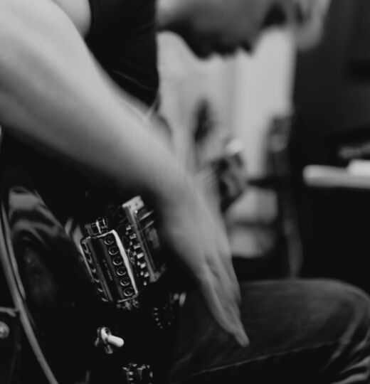 Man holding electric guitar
