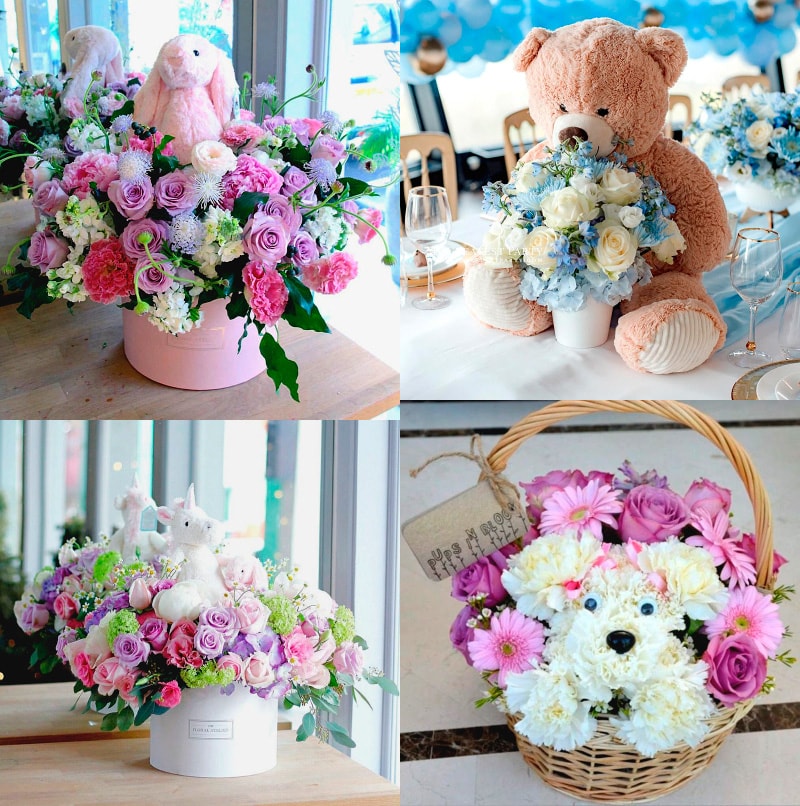 centros florales para bautizo de niño y niña con peluche de oso, conejo, unicornio y perro 