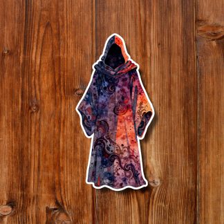 Colorful hooded cloaked figure sticker with purple, red, and orange mystical patterns rests on rustic wooden planks, creating a warm, magical mood.