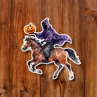 Halloween sticker of a hooded purple horseman riding a galloping brown horse while holding a glowing jack-o’-lantern on rustic wood.