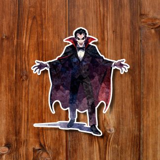 Gothic vampire Dracula sticker with pale face, fangs, black-and-purple cape, and outstretched arms on a warm wooden plank background; dramatic tone.