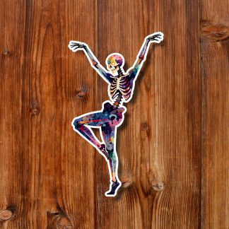 Colorful skeleton sticker dancing on one leg with arms raised against warm brown wooden planks, creating a playful, energetic mood.