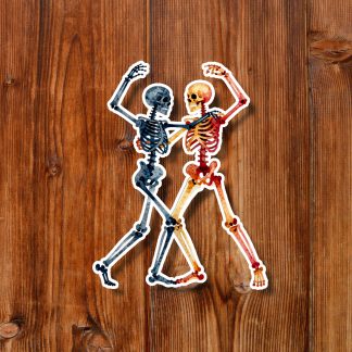 Sticker of two colorful skeletons dancing together on a rustic wooden background, creating a playful, lively, whimsical mood.