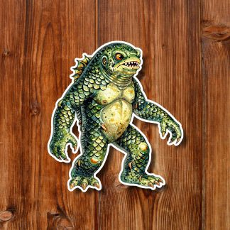 Colorful cartoon reptile monster sticker with scales, claws, and open toothy mouth on a warm wooden plank background; fierce and scary.