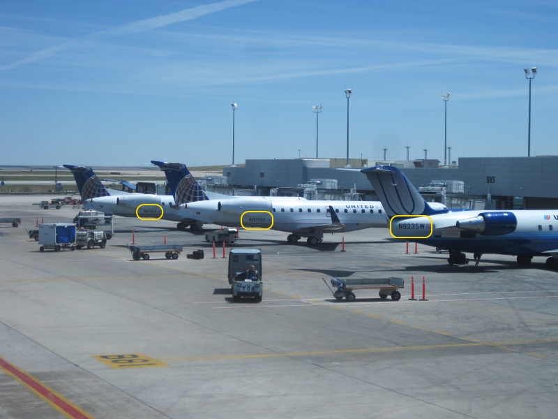 Photo of several aircraft with their tail numbers highlighted