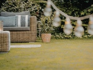 How can you create a cozy evening atmosphere outdoors?