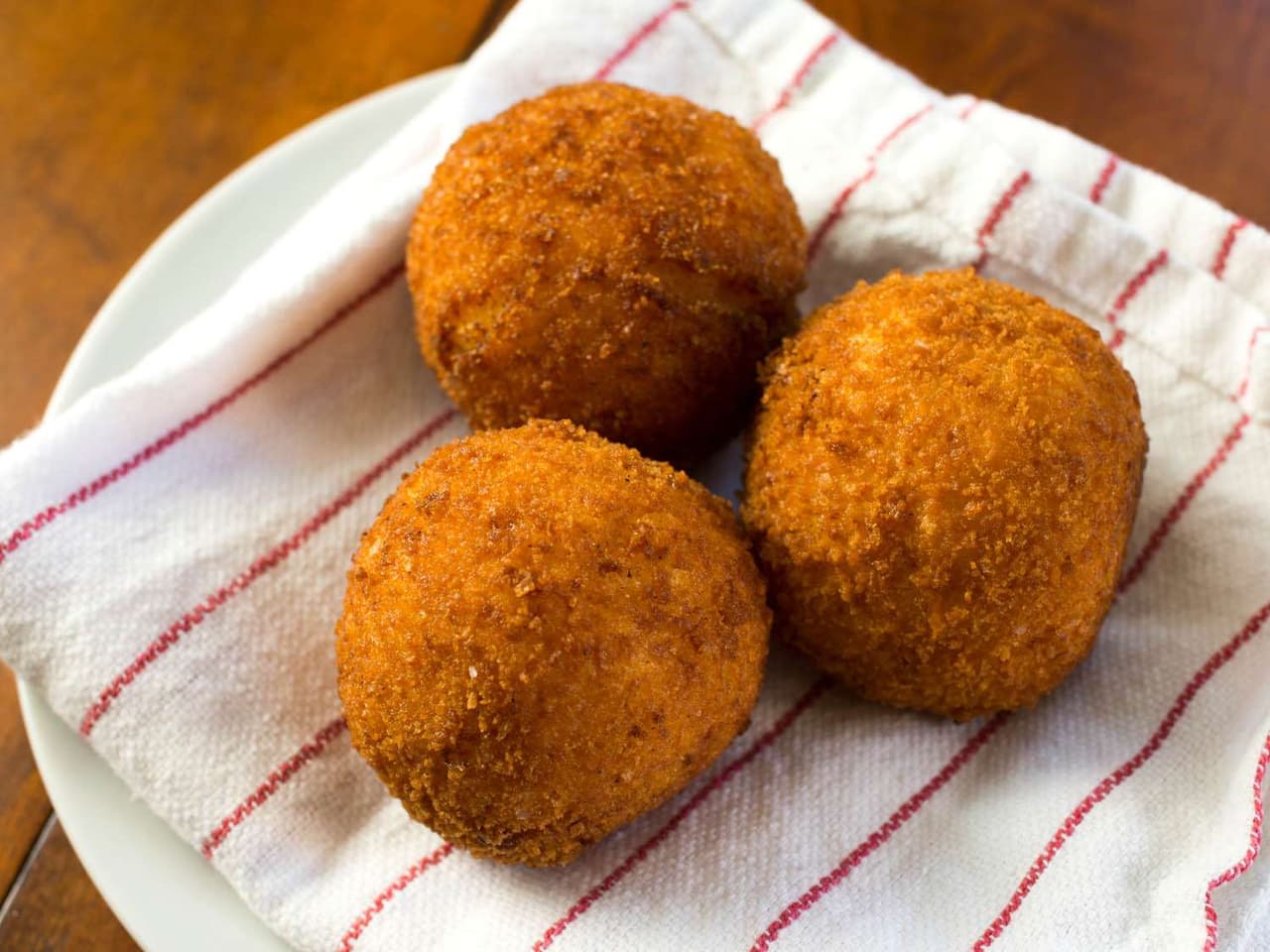 Rich and Creamy Saffron Arancini with Mozzarella | Punchfork