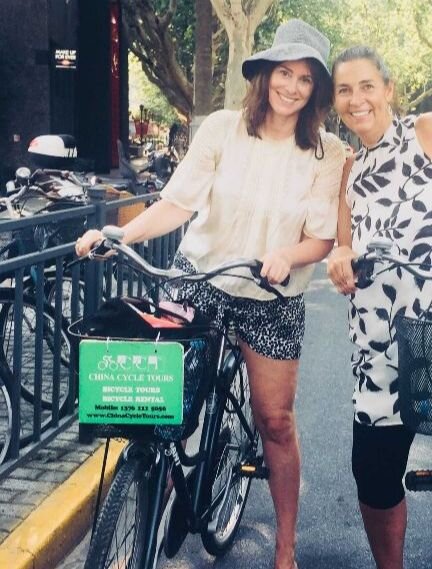Monica &amp; her college friend biking through the former French Concession, Shanghai.