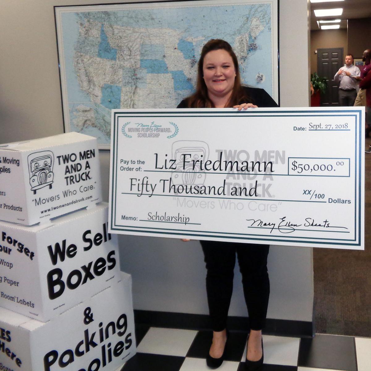 Liz Holding Scholarship Check
