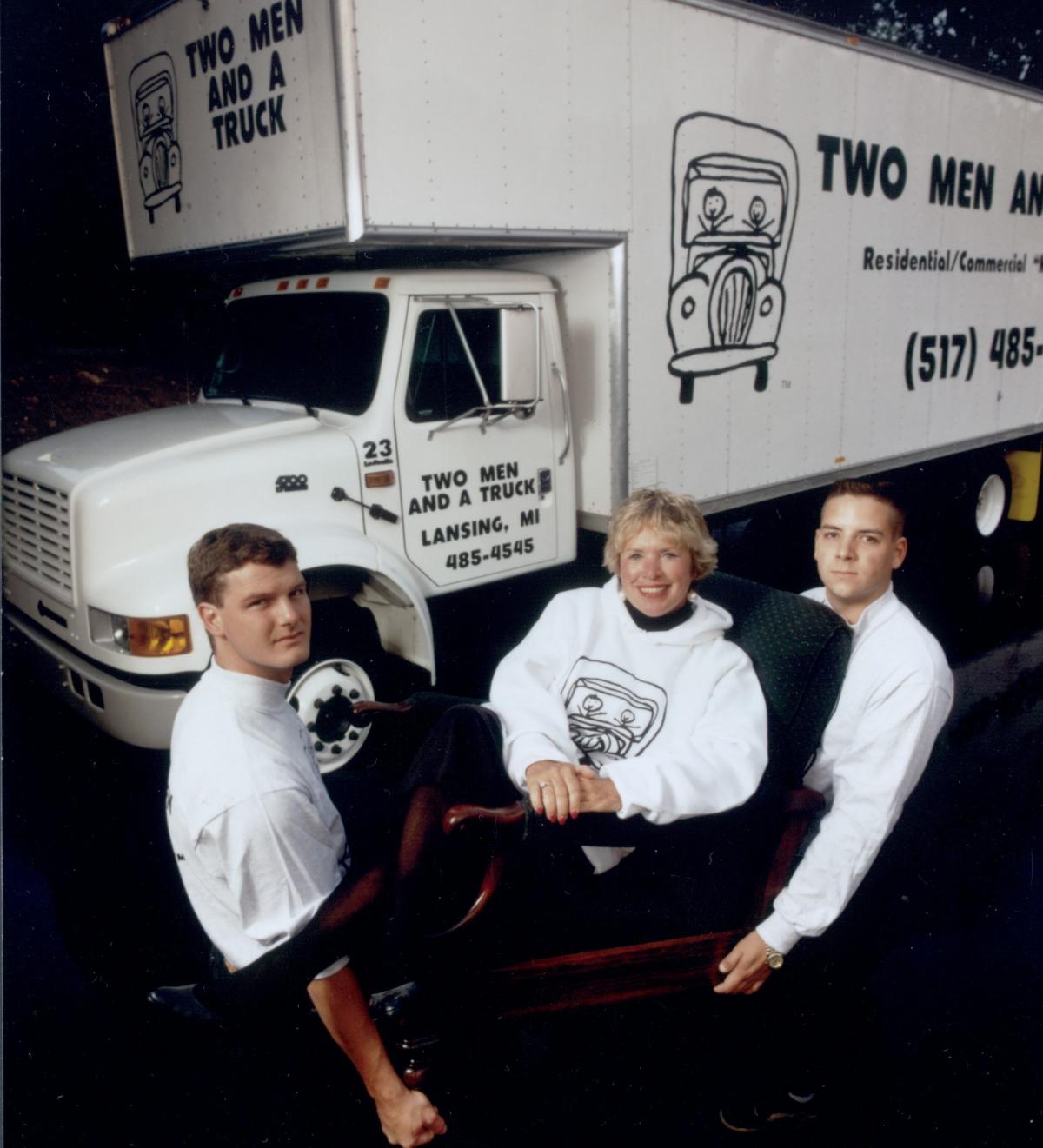 Team members in front of truck