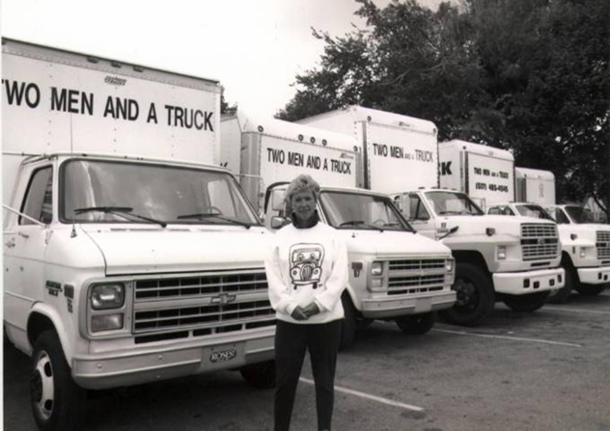 Mary Ellen in front of trucks