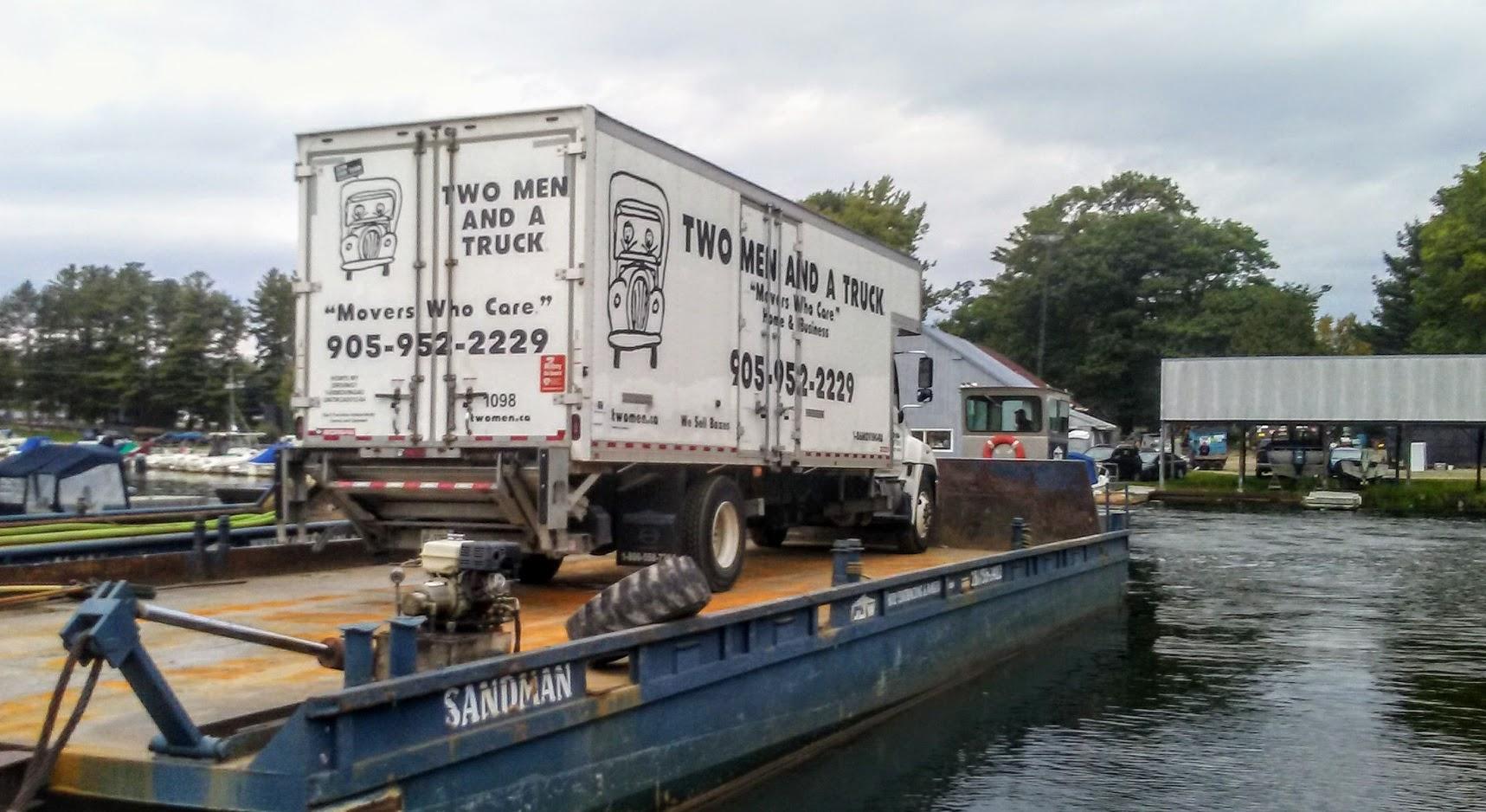 Two Men and a Truck Newmarket Truck on a Barge