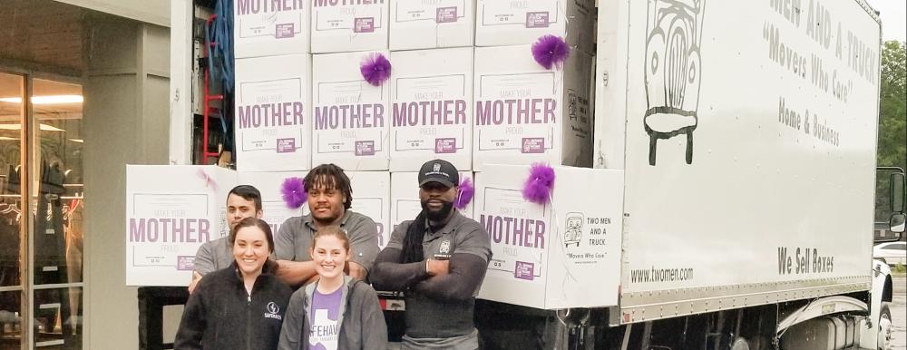 TWO MEN AND A TRUCK movers dropping off donations at SafeHaven of Tarrant County