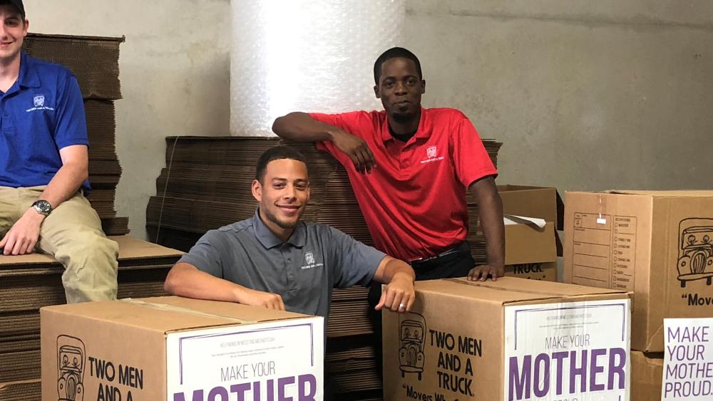 two men and a truck movers for moms team photo