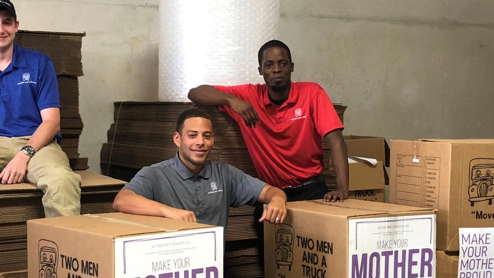 two men and a truck movers for moms team photo sugar land