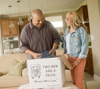 couple packing boxes at home Thumbnail