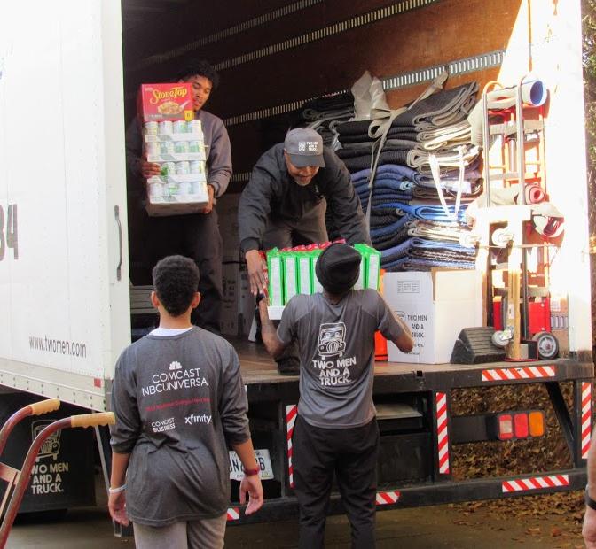 TWO MEN AND A TRUCK movers volunteering at The Center of Fanily Resources.