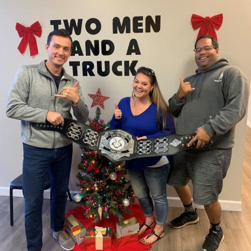 Sales Team holding Profits MVP belt