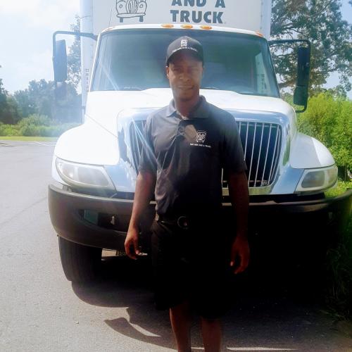 Tony in front of one moving truck in Ocala