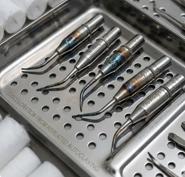 close-up-of-hu-friedy-ultrasonic-scaler-tips-showing-discoloration-or-darkened-areas-on-the-metal-surface-after-repeated-autoclaving-placed-on-a-sterile-dental-tray..webp