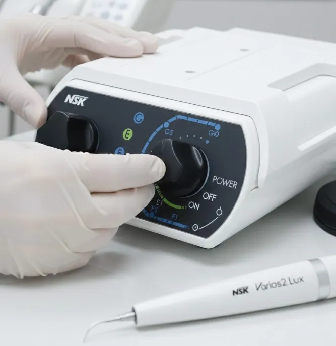 close-up-of-nsk-ultrasonic-scaler-control-panel-being-adjusted-for-precise-power-settings-during-clinical-calibration..webp