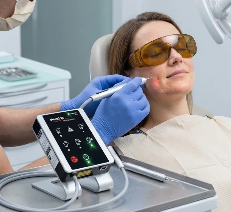 dental-professional-using-an-elexxion-low-level-laser-therapy-device..webp