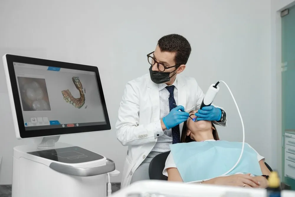 dentist-using-intraoral-scanner-on-patient-slight-movement-blur-clinical-setting-high-resolution_result.webp