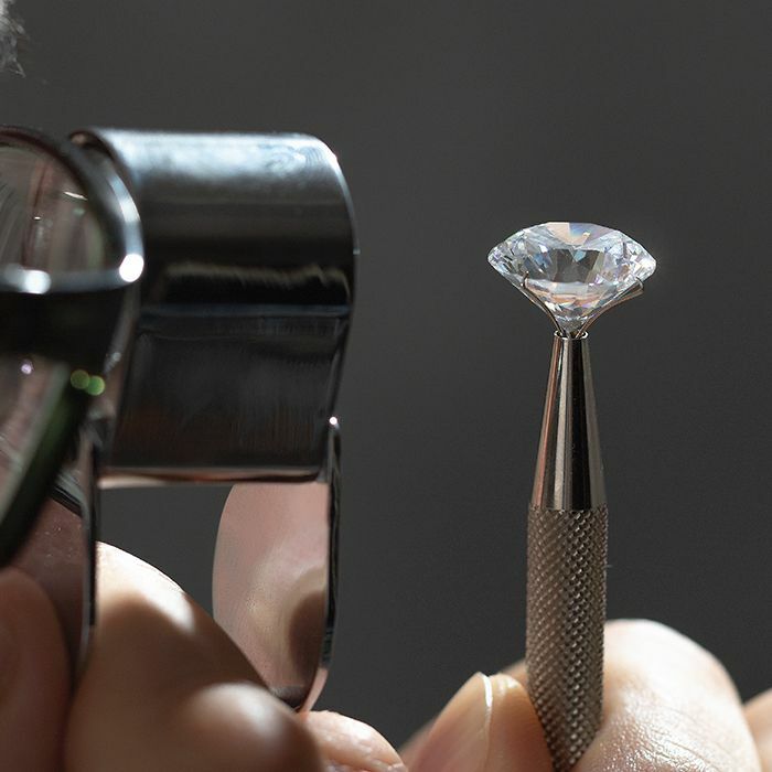 Diamond being examined up close by jeweler