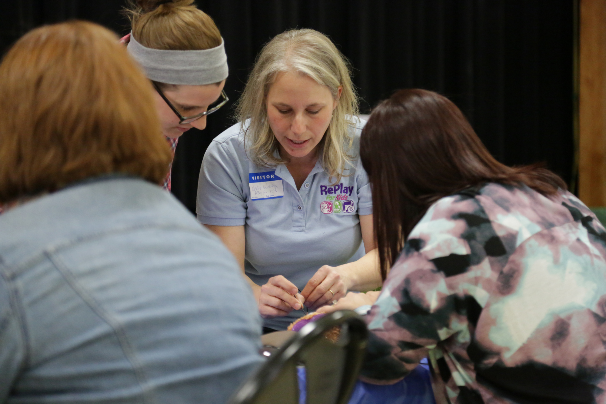 Staff and families participating in RePlay for Kids DD Awareness Month event.