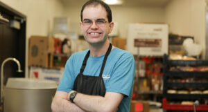 Matt standing in the kitchen at his workplace