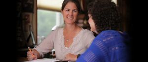 Smiling SSA working with a young woman