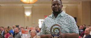 2019 Self-Advocate of the year award winner Shaq holding his award
