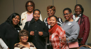 8 staff members from Louisa Ridge posing for photo at Summit DD Appreciation Breakfast