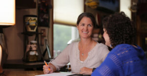 Smiling SSA meeting with a young woman about her ISP