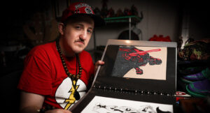 Darick showing his artwork.