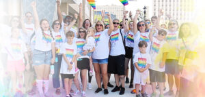Summit DD staff cheering together at the Akron Pride Festival.