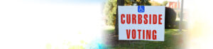 "Curbside Voting" sign with accessibility symbol