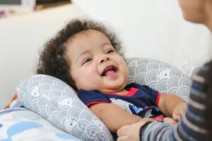Julian with his mother at an EI home visit.